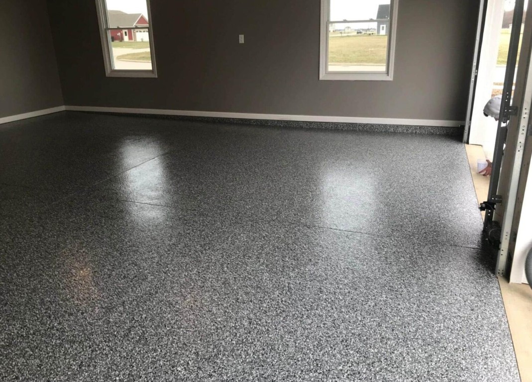 Professional epoxy garage floor coating with durable speckled finish