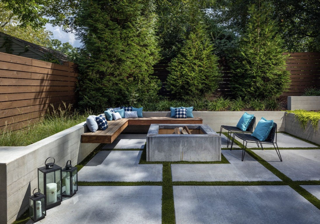 Modern concrete patio with retaining walls and masonry work for luxury outdoor spaces in Land O Lakes